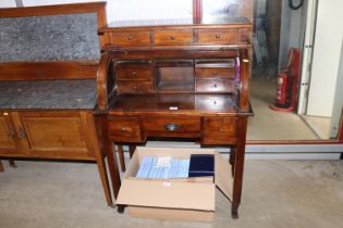 A modern hardwood cylinder bureau