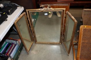 A gilt triptych mirror AF; and a frameless mirror