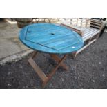 A blue painted wooden folding garden table