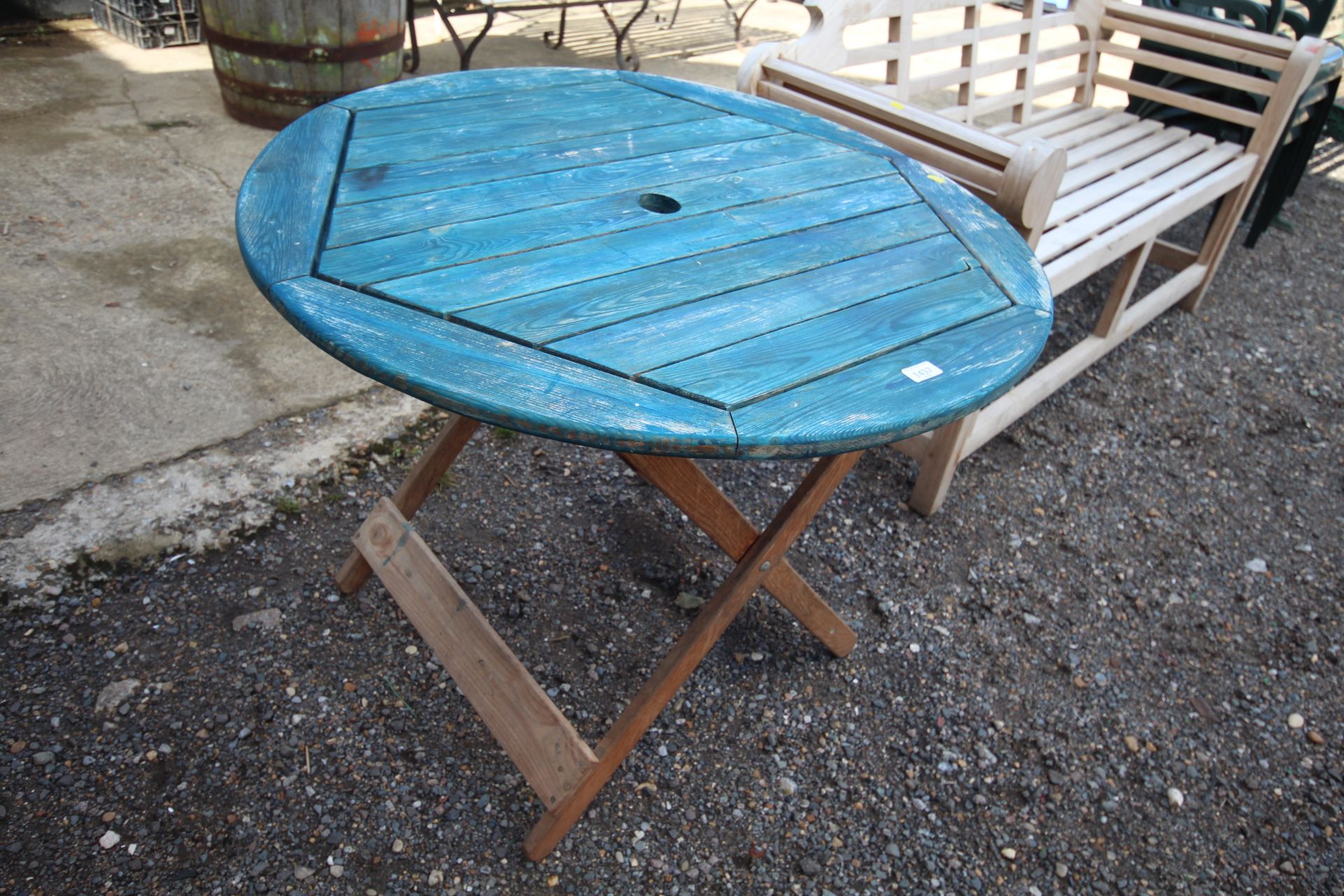 A blue painted wooden folding garden table