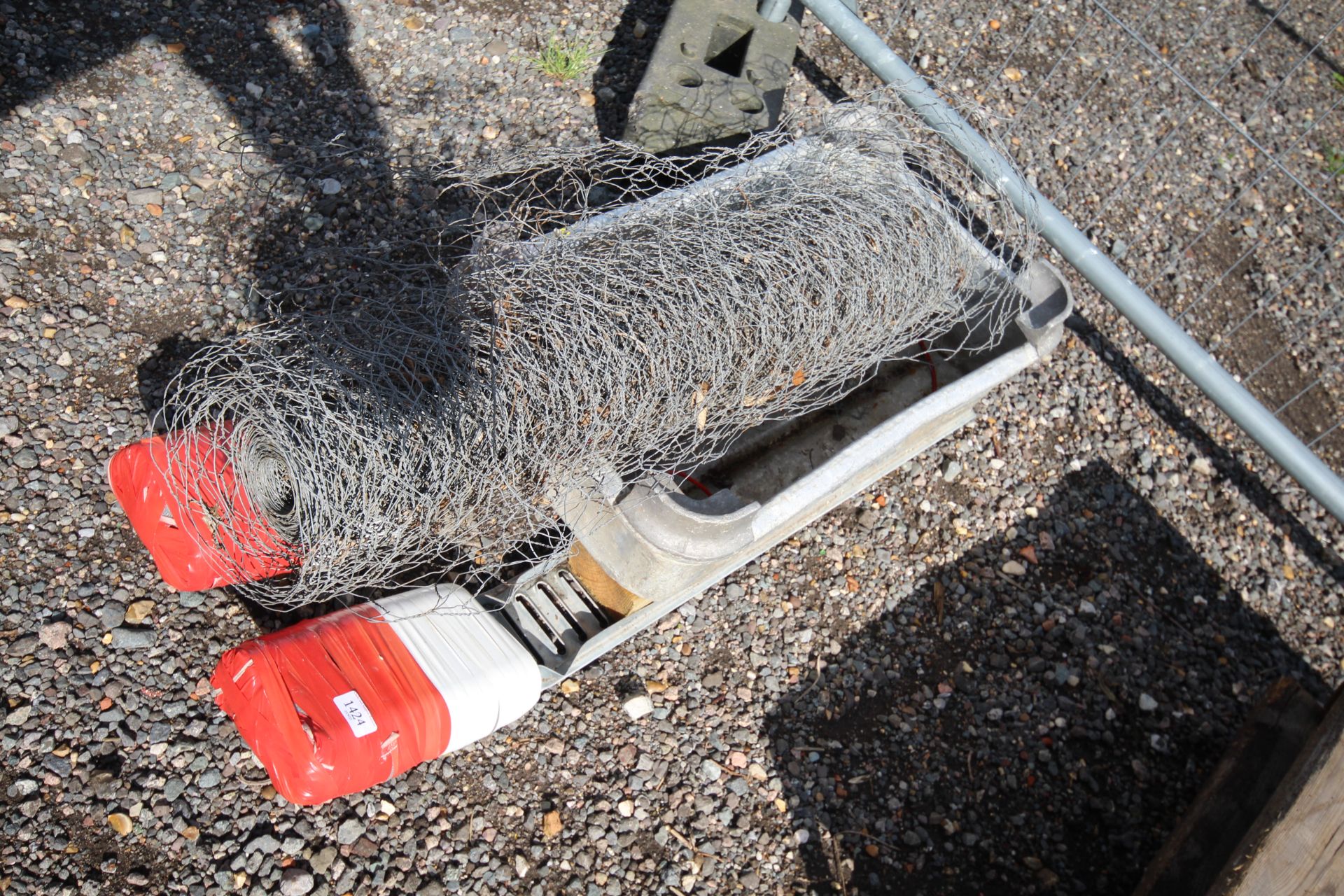 A pull along garden barrow on skids together with