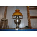 An Aladdin oil lamp with a plate glass shade and c