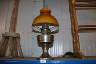 An Aladdin oil lamp with a plate glass shade and c