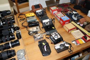 A collection of vintage and modern cameras