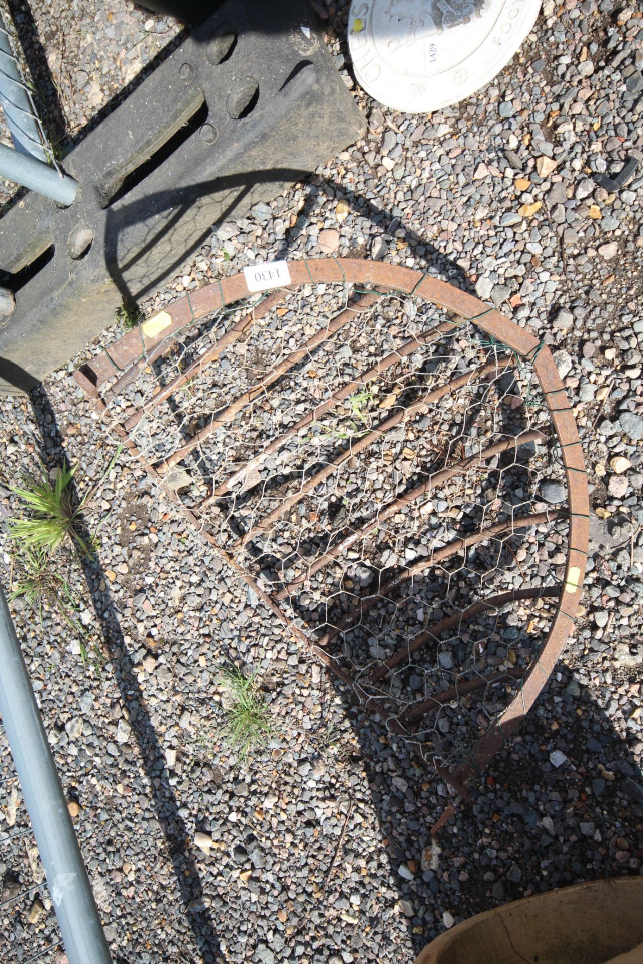 A wall mounting cast iron hay rack