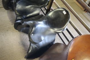 A leather horse riding saddle