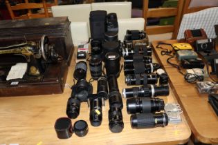 A collection of various camera lenses including Si