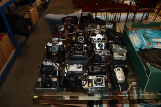 A collection of various vintage and modern cameras