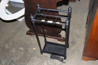 A cast iron six division stick stand