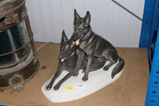 A porcelain group in the form of two dogs