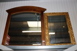 A modern wall mirror and gilt framed and bevelled