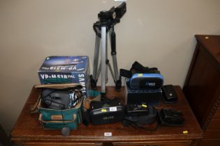 A Samsung video camera, camera tripod, various cam