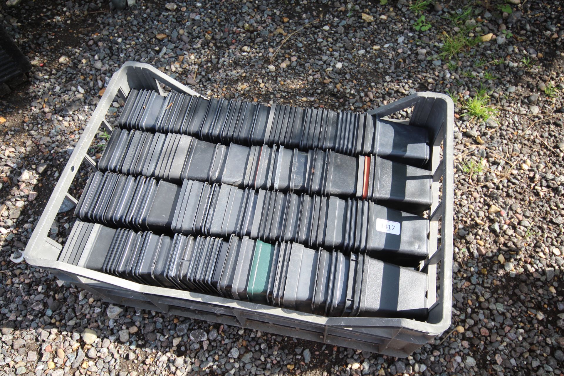 A quantity of small plastic plant pots