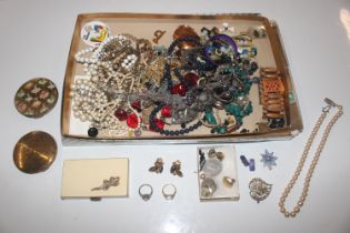 A tray of various costume jewellery and compacts