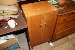 A teak two door record cabinet