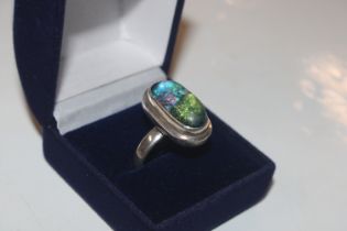 A silver and Dichroic glass ring