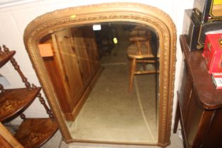 A gilt framed and bevel edged overmantel mirror, 9