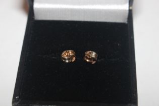 A pair of 9ct white and yellow gold stud ear-rings