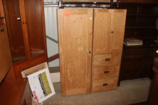 A stripped pine single door cupboard and a strippe