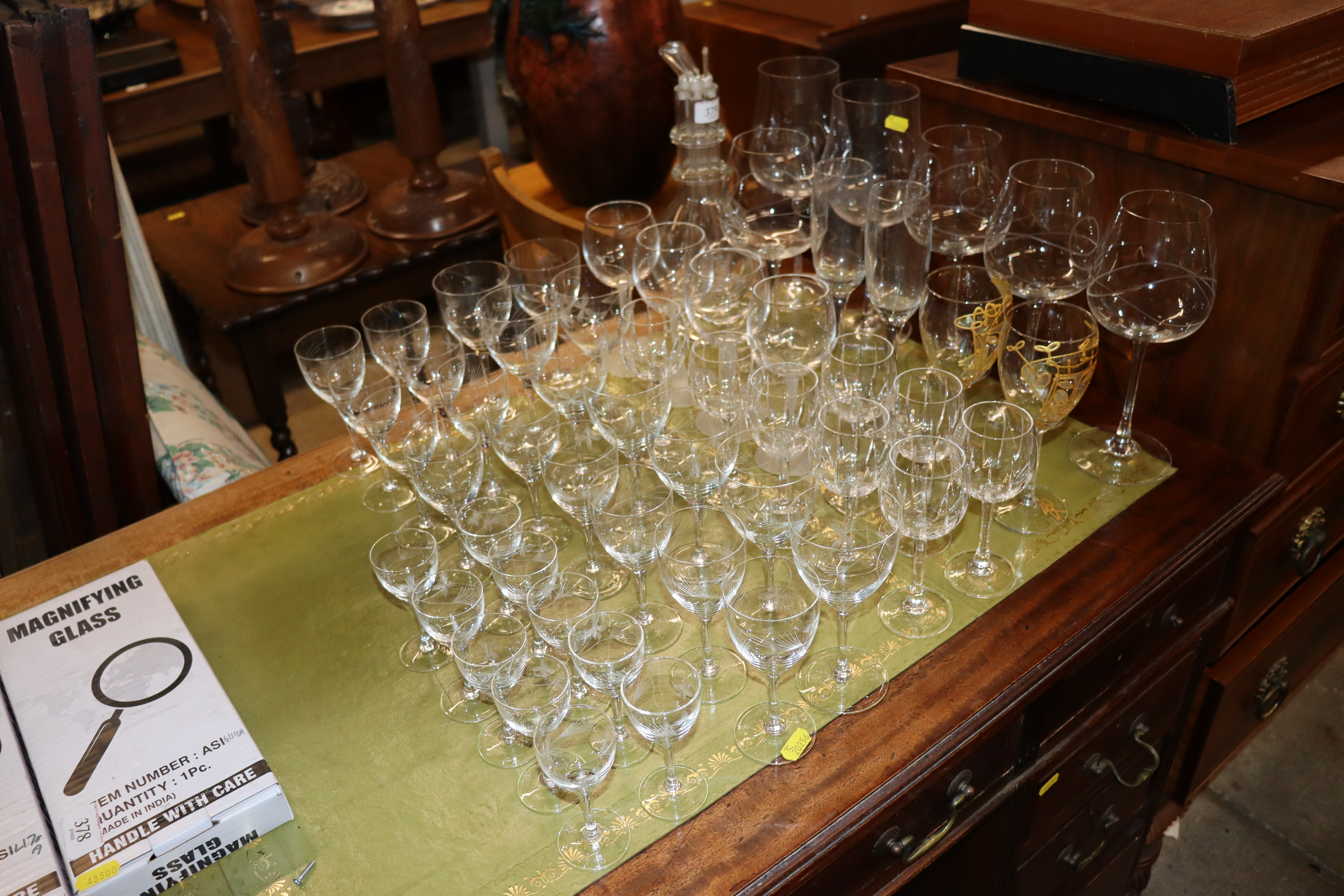 A quantity of various drinking glasses and a four