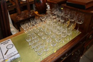 A quantity of various drinking glasses and a four