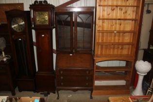 A bureau bookcase raised on ball and claw supports