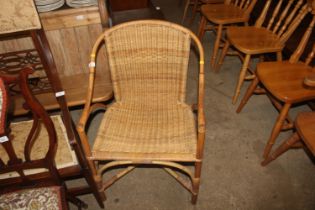 A cane and wicker armchair