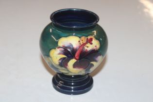 A William Moorcroft vase with tube lined decoratio