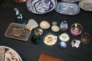 A quantity of various paperweights; hard stone egg