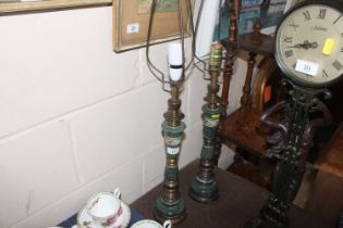A pair of green marble gilt decorated table lamps