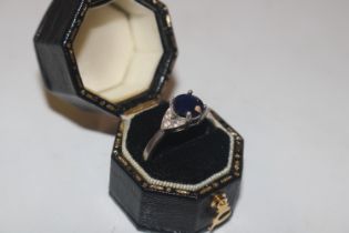 A TGGC Sterling silver sapphire and diamond ring,