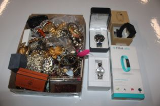 A large quantity of costume jewellery and wrist wa