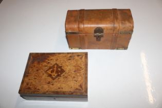 A leather covered jewellery chest in the form of a