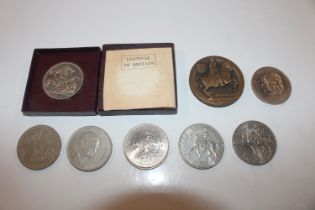 A 1951 five shilling coin; a 1951 Festival of Brit