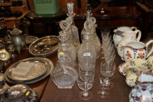 A quantity of decanters and drinking glasses