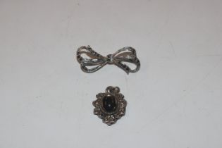 A 925 silver and marcasite bow brooch and a pendan