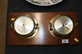 A Garrard & Co Limited of London mounted barometer and clock