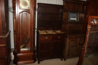 A 19th Century oak dresser raised on cupboard base