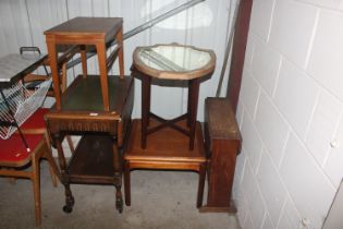 A bevel edged shield shaped mirror; a teak side ta