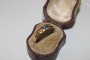 An 18ct gold sapphire and diamond set ring, ring si