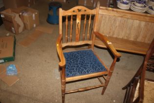 An oak and upholstered spindle back chair