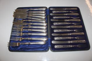 A cased set of six each silver handle fruit knives
