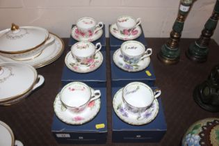 Six boxed Royal Kendall cups and saucers decorated