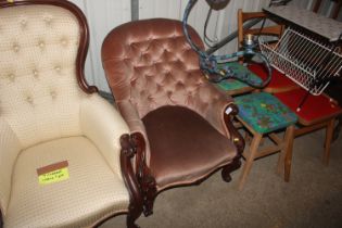 A Victorian button back upholstered armchair