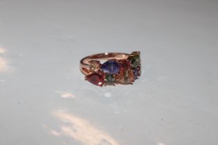 A dress ring set with multi-coloured stones, ring