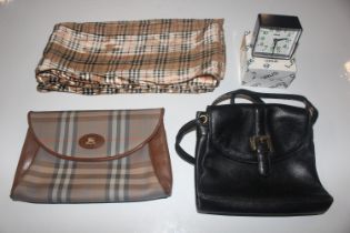 A box containing Burberry bag, a scarf, handbag an