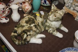 A Winstanley pottery model of a cat with glass eye