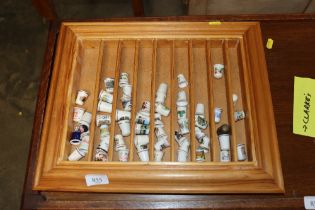 A display shelf and collection of thimbles