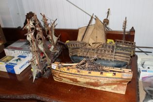 Three wooden model boats