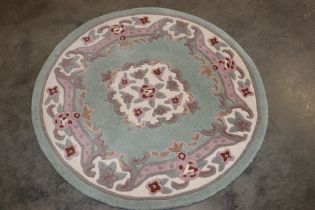 An approx. 4' diameter circular patterned rug